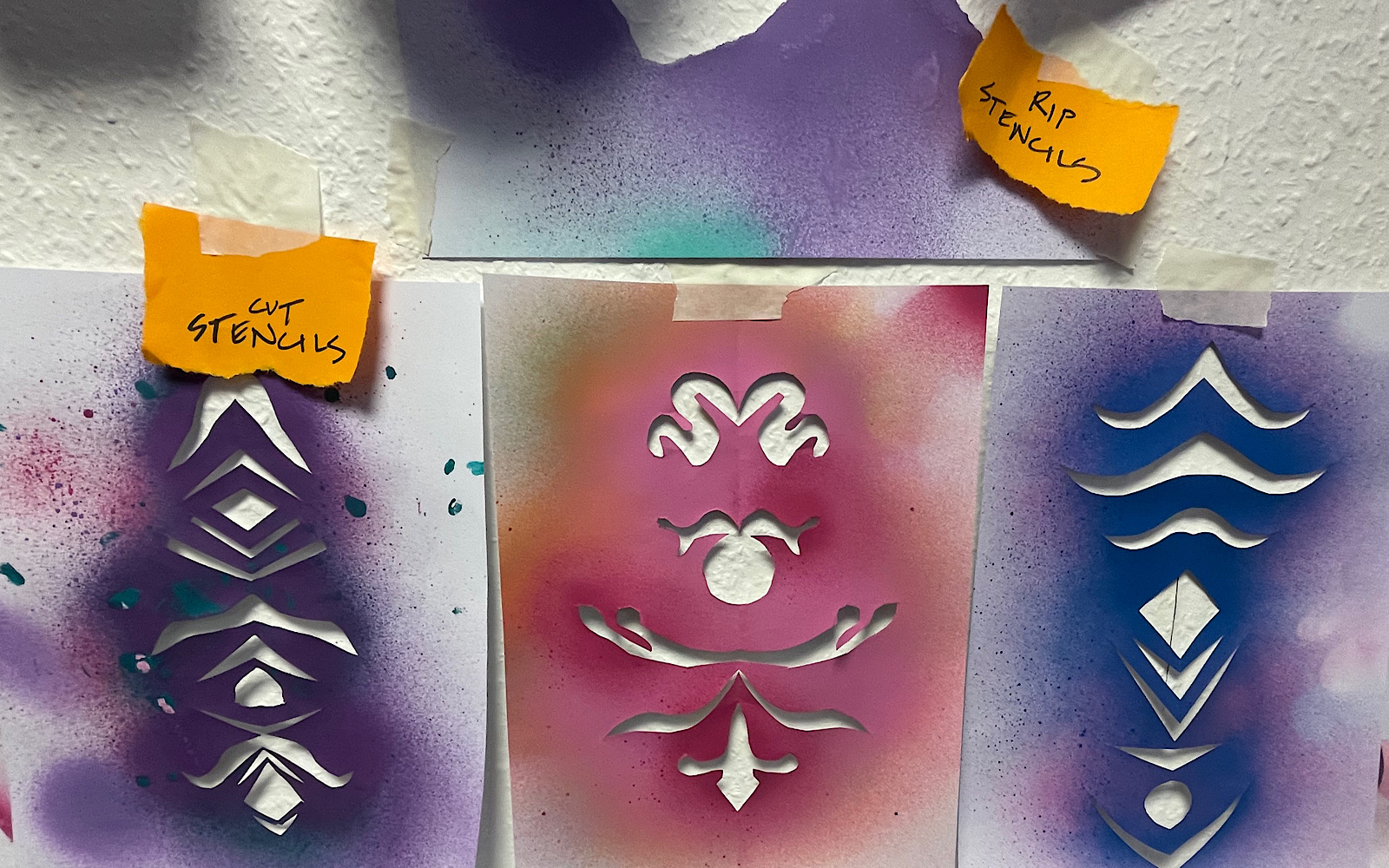 Stencils that have been made with scissors but also ripping paper