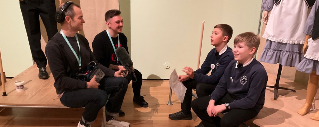 Two primary school students record their podcast