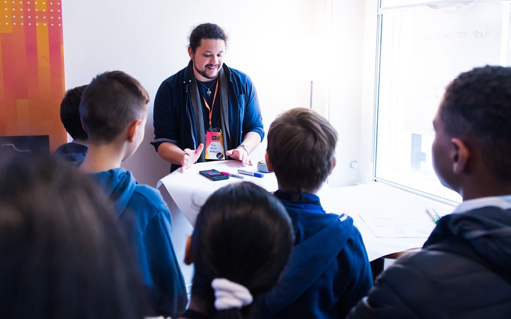 A practitioner leads a workshop