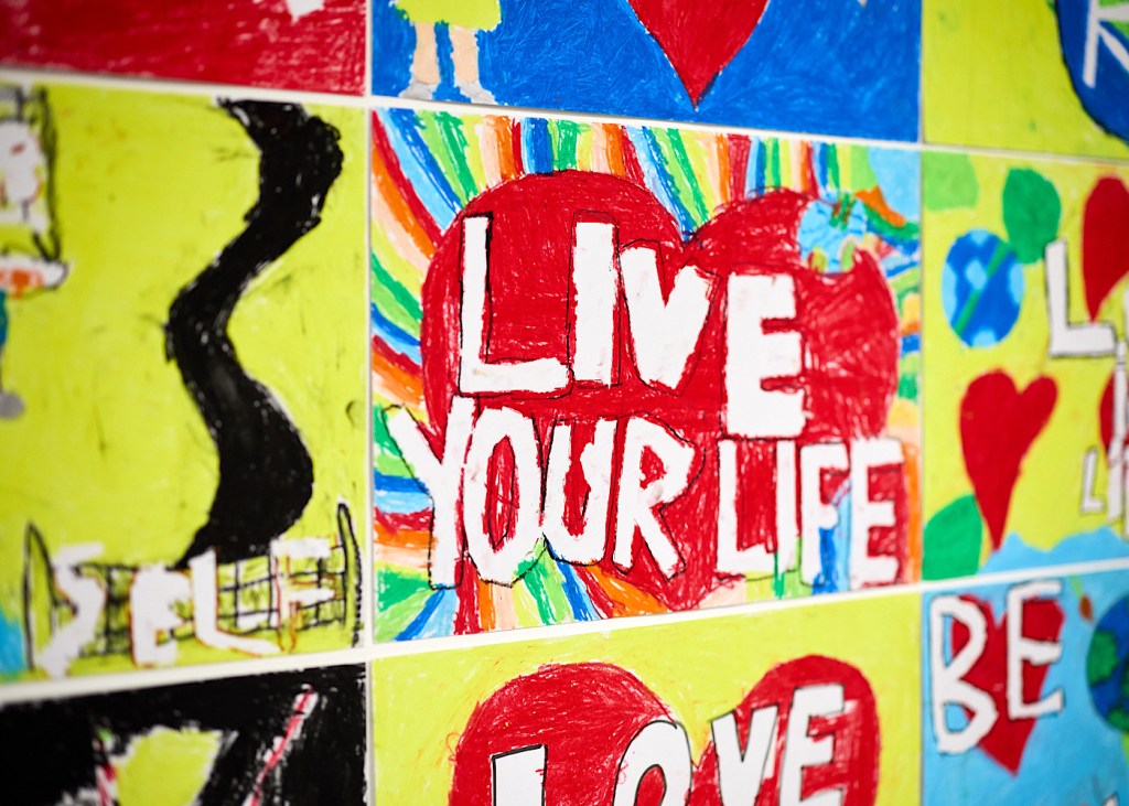 A piece of art made by a primary school student says ‘live your life’