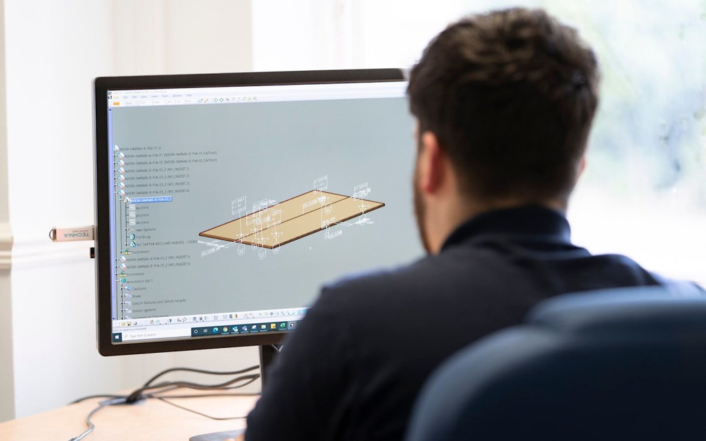 A student working on design on a computer