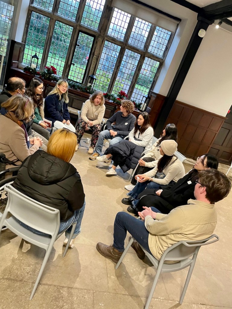 A circle of students discuss the arts in a workshop