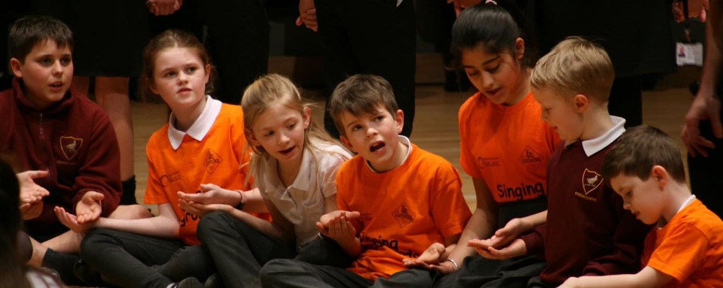 A group of children taking part in a workshop