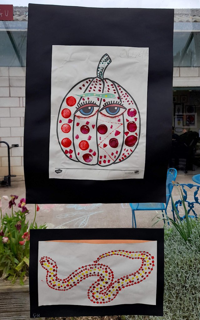 Two paintings, one of a snake and one of a root vegetable