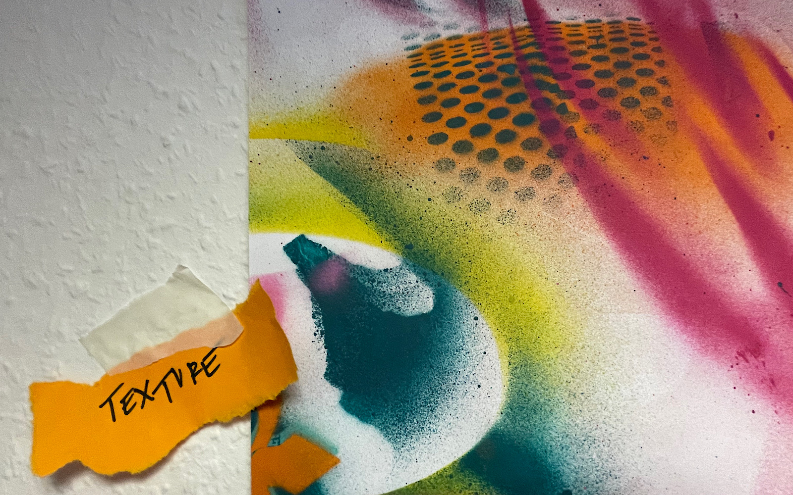 A note says ‘texture’ and is taped next to a painting on a wall